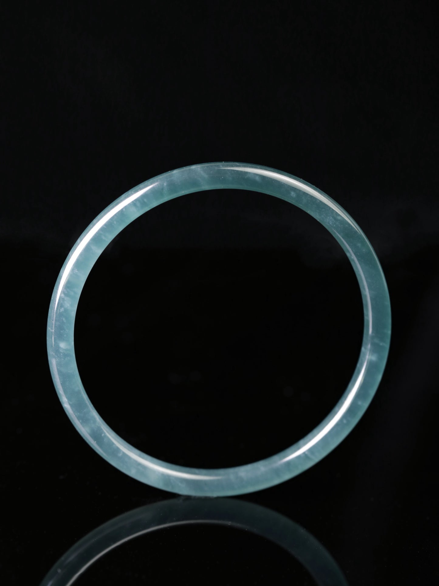 Blue-water round-profile jadeite bangle, size 60mm.