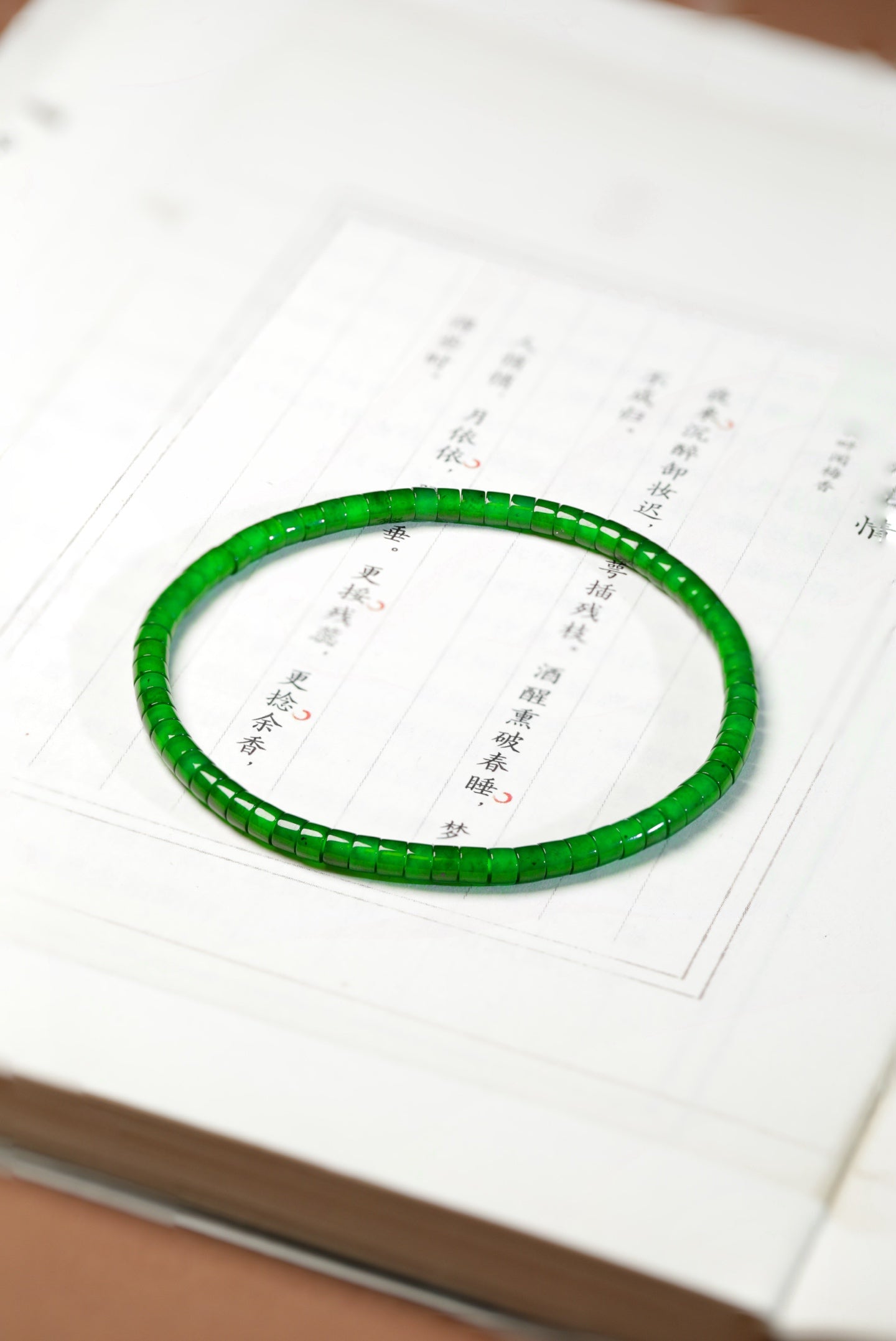 Barrel-bead jadeite bangles, 68 beads, dimensions 3.4mm x 2.5mm.