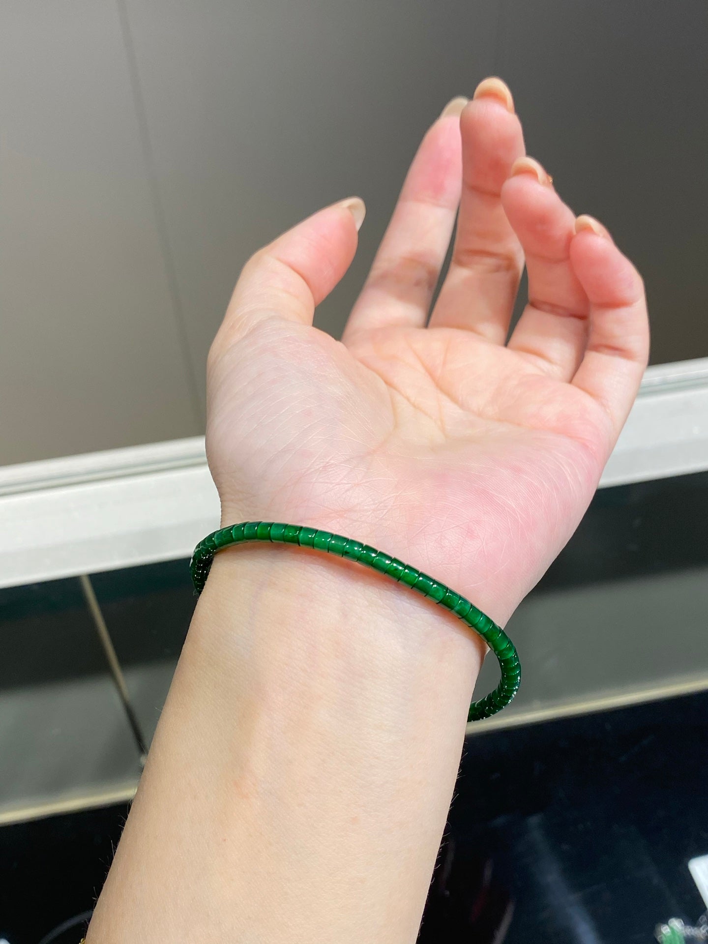 Barrel-bead jadeite bangles, 68 beads, dimensions 3.4mm x 2.5mm.