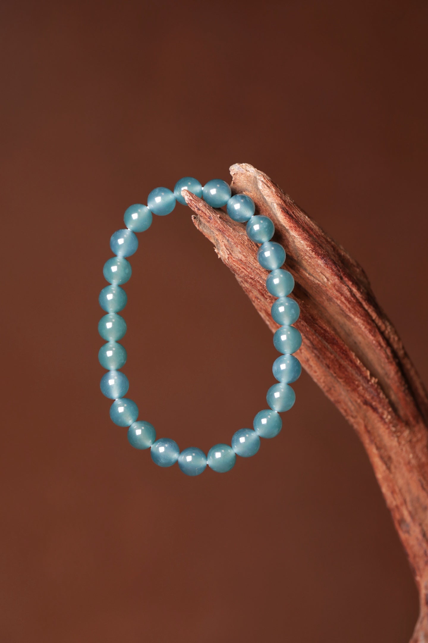 Blue-water round bead bracelet; bead size 8mm, 25 beads.