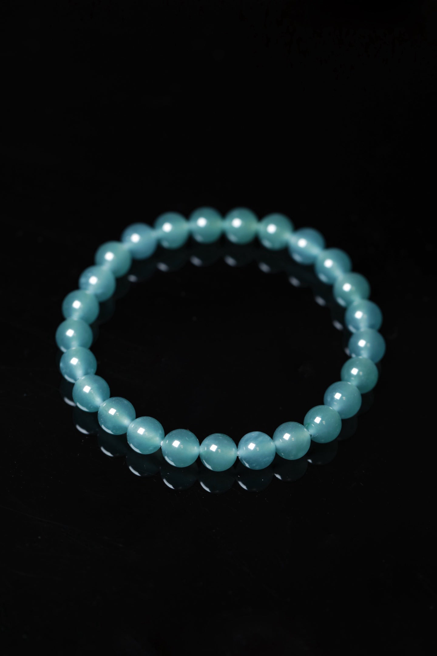 Blue-water round bead bracelet; bead size 8mm, 25 beads.