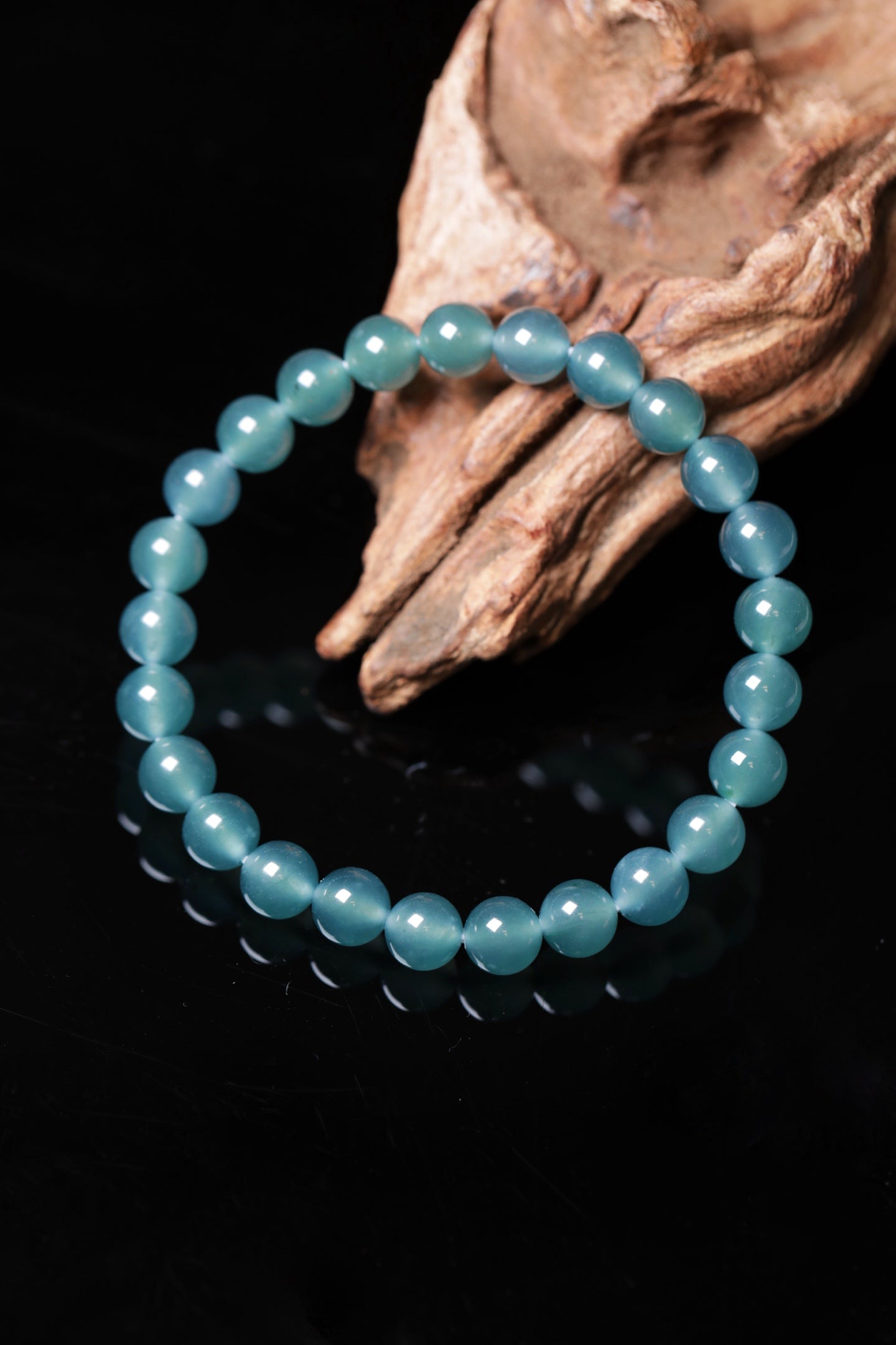 Blue-water round bead bracelet; bead size 8mm, 25 beads.