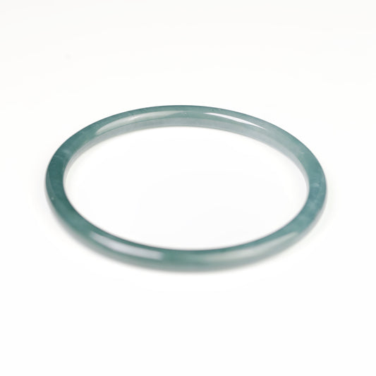 Blue-water round-profile jadeite bangle, size 60mm.