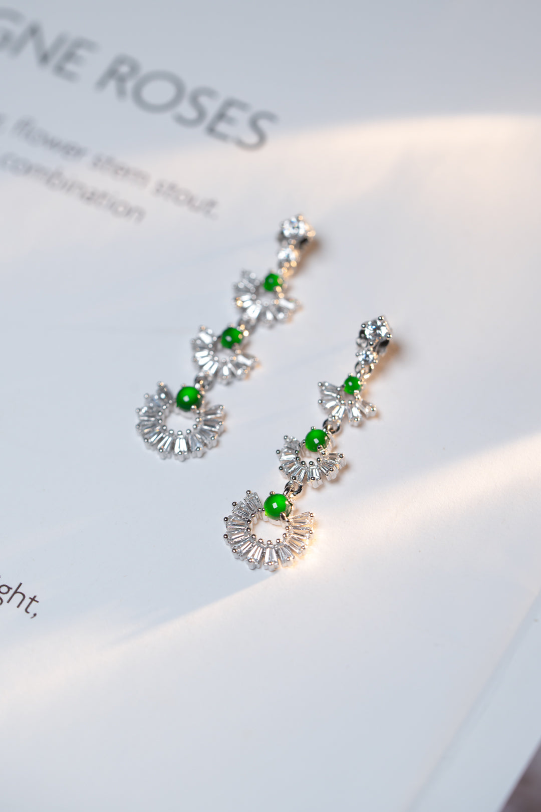 925 silver and oval jadeite cabochon earrings; overall dimensions: 25.5mm x 10mm x 2.5mm.