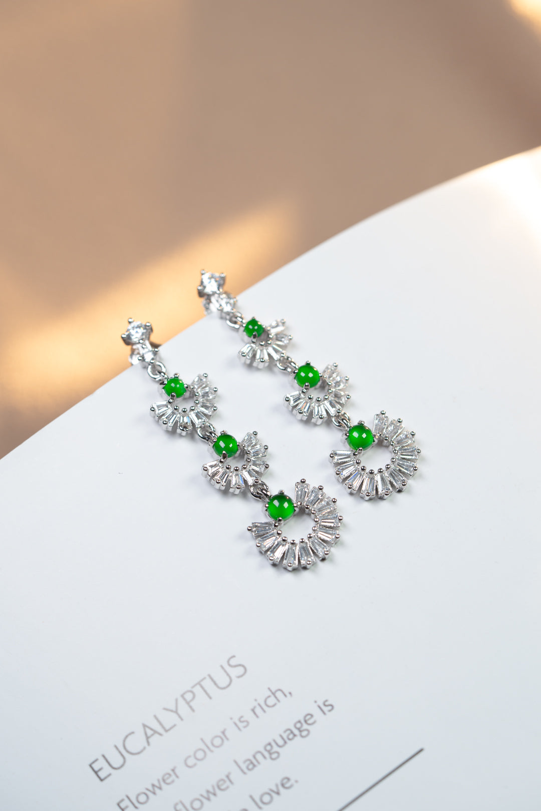 925 silver and oval jadeite cabochon earrings; overall dimensions: 25.5mm x 10mm x 2.5mm.