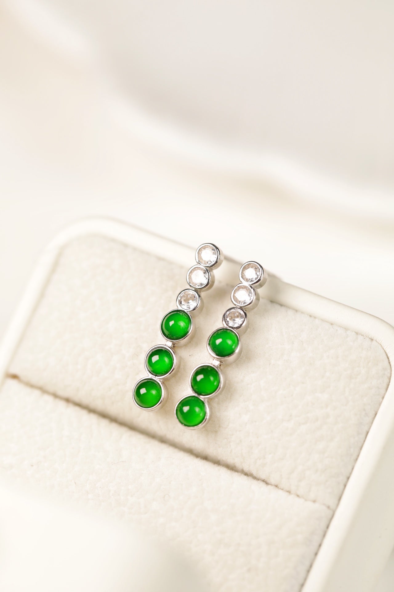 925 silver jadeite drop earrings featuring oval cabochons; overall dimensions: 22mm x 4.4mm x 2.5mm.