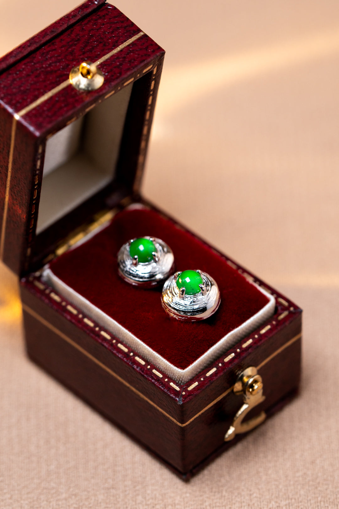 925 silver jadeite stud earrings with oval cabochons; overall dimensions: 7.6mm x 7.6mm x 4.9mm.