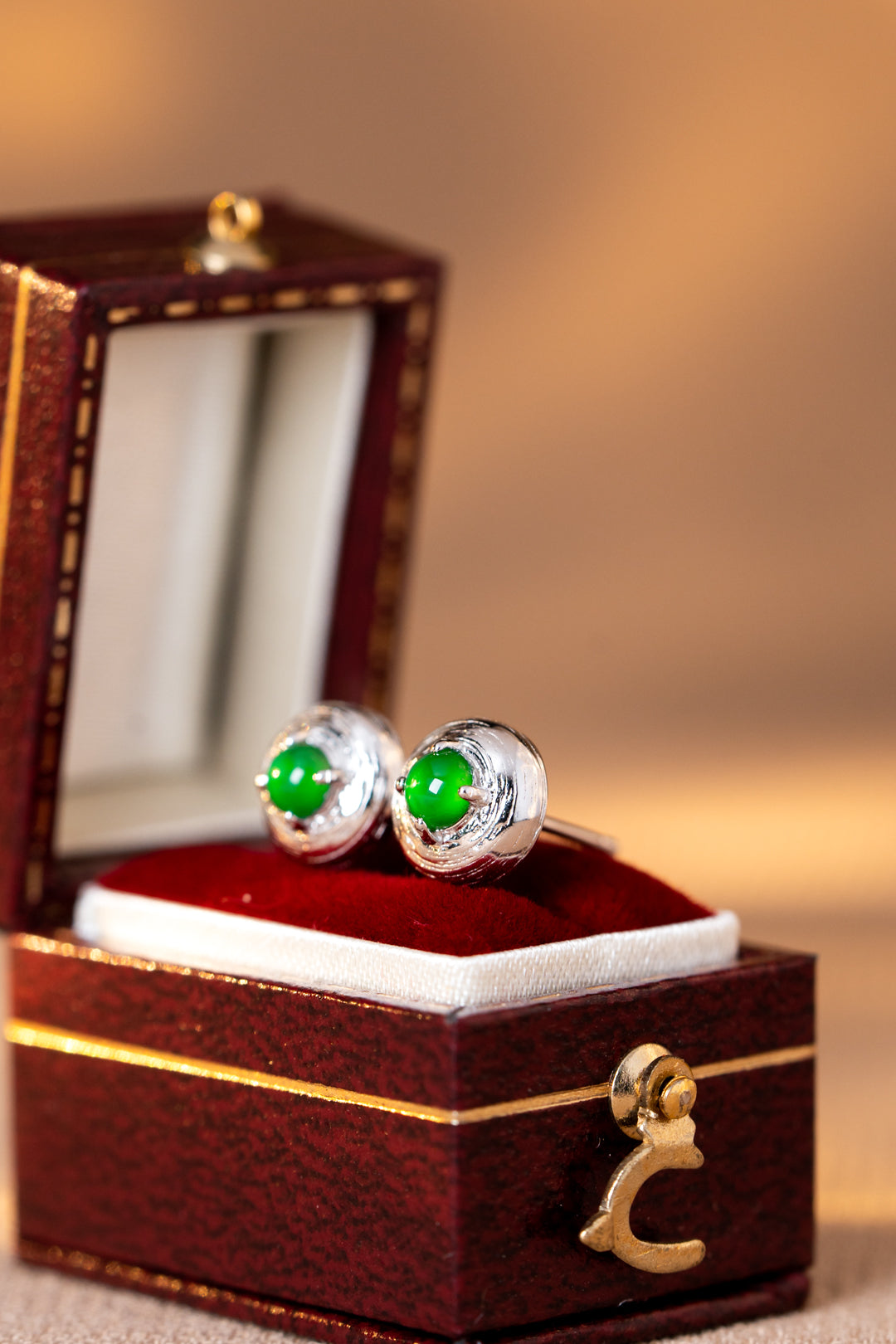 925 silver jadeite stud earrings with oval cabochons; overall dimensions: 7.6mm x 7.6mm x 4.9mm.