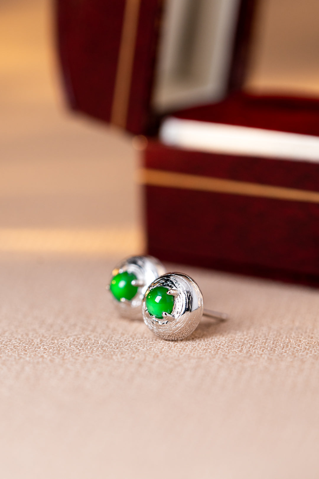 925 silver jadeite stud earrings with oval cabochons; overall dimensions: 7.6mm x 7.6mm x 4.9mm.