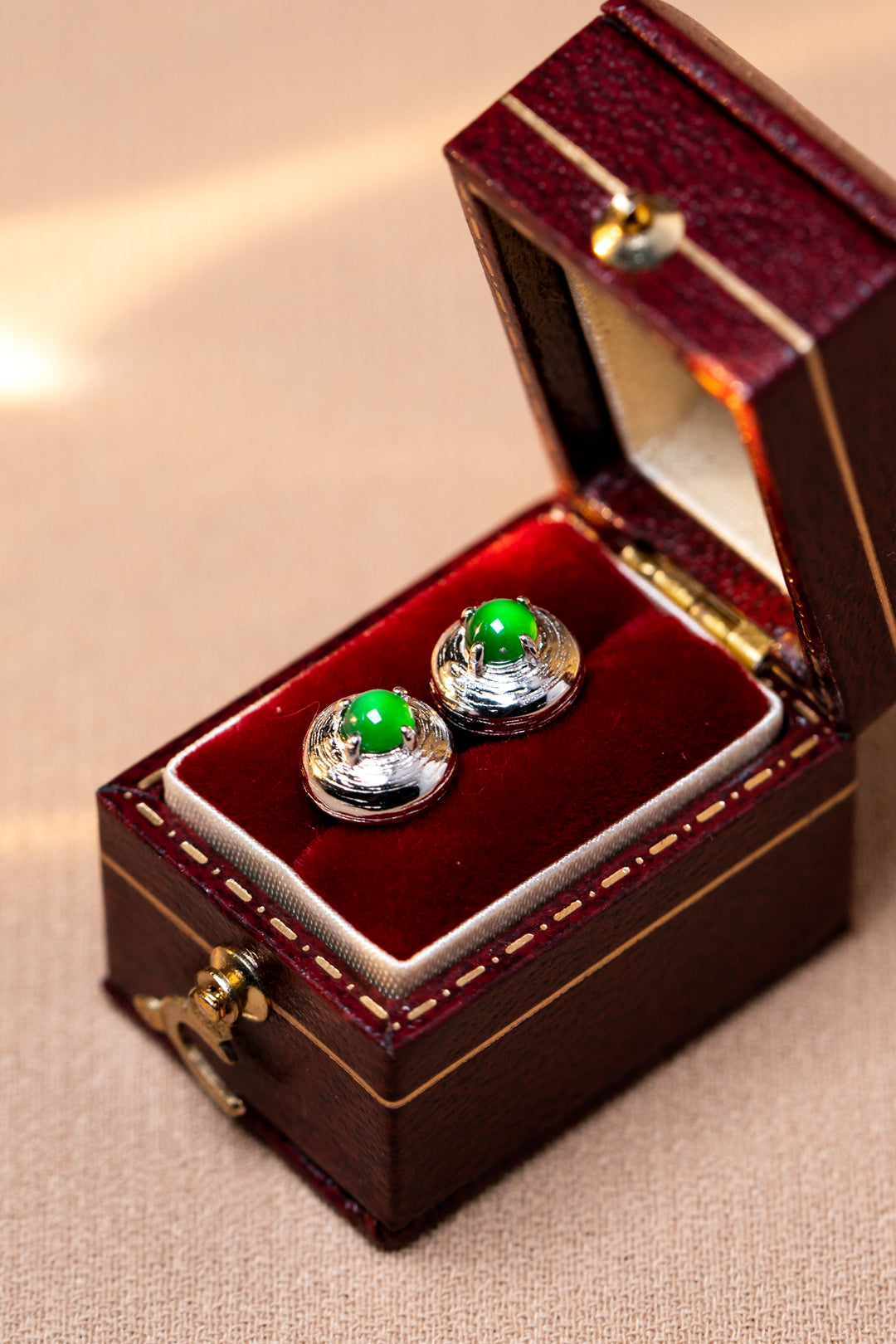 925 silver jadeite stud earrings with oval cabochons; overall dimensions: 7.6mm x 7.6mm x 4.9mm.